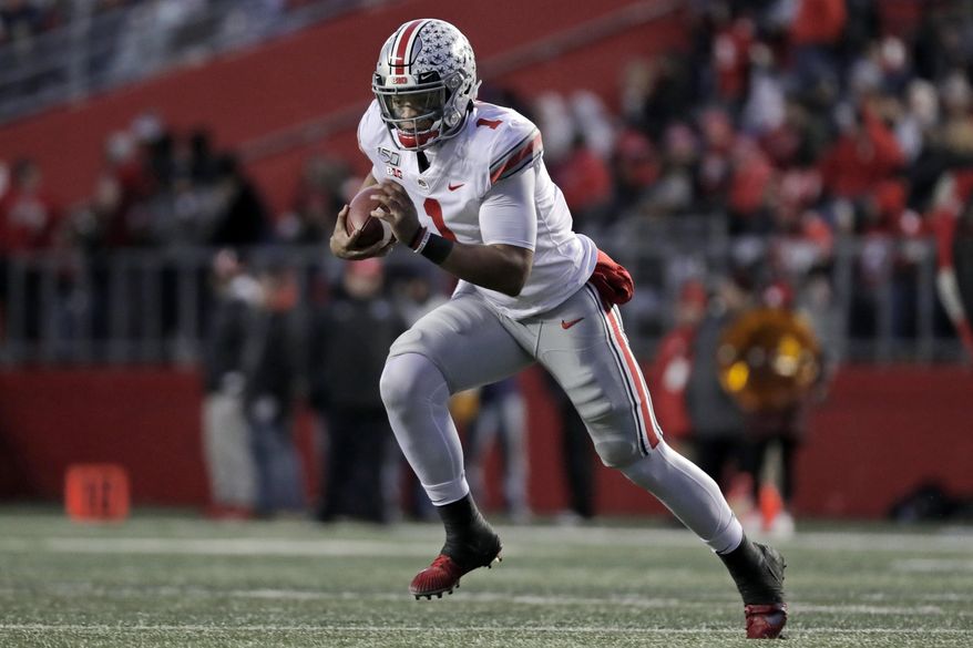 Ohio State quarterback Justin Fields (1) rushes against Rutgers during the first half of an NCAA college football game Saturday, Nov. 16, 2019, in Piscataway, N.J. (AP Photo/Adam Hunger)