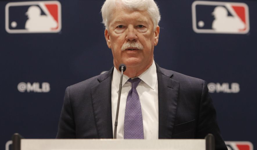 New Kansas City Royals owner John Sherman makes a brief statement to reporters after a baseball owners meeting in Arlington, Texas, Thursday, Nov. 21, 2019. (AP Photo/LM Otero)
