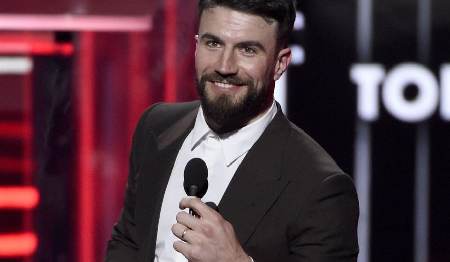 This May 20, 2018 file photo shows Sam Hunt accepting the award for top country song for "Body Like A Back Road" at the Billboard Music Awards in Las Vegas. Hunt was arrested for driving under the influence and violation of the open container law after police in Nashville stopped him for driving the wrong way down a one-way road. Hunt was arrested Thursday morning about 6:30 a.m., booked into jail and released from jail on a $2,500 bond, according to WKRN-TV. (Photo by Chris Pizzello/Invision/AP, File) **FILE**