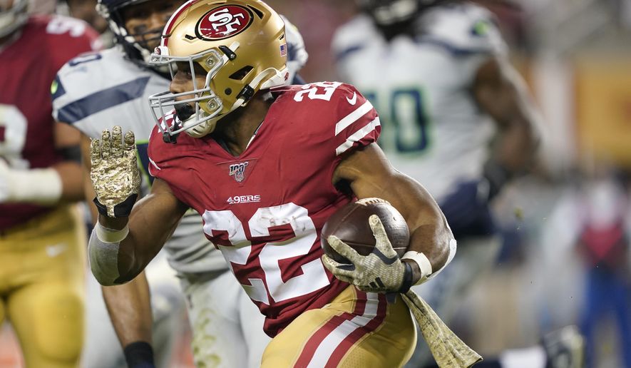 San Francisco 49ers running back Matt Breida (22) runs against the Seattle Seahawks during the first half of an NFL football game in Santa Clara, Calif., Monday, Nov. 11, 2019. (AP Photo/Tony Avelar)