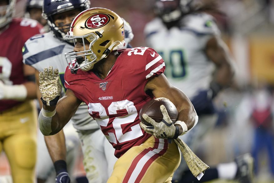 San Francisco 49ers running back Matt Breida (22) runs against the Seattle Seahawks during the first half of an NFL football game in Santa Clara, Calif., Monday, Nov. 11, 2019. (AP Photo/Tony Avelar)