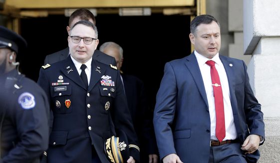 National Security Council aide Lt. Col. Alexander Vindman, left, walks with his twin brother, Army Lt. Col. Yevgeny Vindman, after testifying before the House Intelligence Committee on Capitol Hill in Washington, Tuesday, Nov. 19, 2019, during a public impeachment hearing of President Donald Trump&#39;s efforts to tie U.S. aid for Ukraine to investigations of his political opponents. (AP Photo/Julio Cortez) ** FILE **