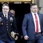National Security Council aide Lt. Col. Alexander Vindman, left, walks with his twin brother, Army Lt. Col. Yevgeny Vindman, after testifying before the House Intelligence Committee on Capitol Hill in Washington, Tuesday, Nov. 19, 2019, during a public impeachment hearing of President Donald Trump&#x27;s efforts to tie U.S. aid for Ukraine to investigations of his political opponents. (AP Photo/Julio Cortez) ** FILE **