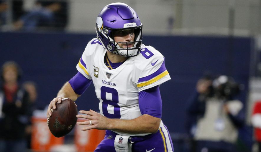 Minnesota Vikings quarterback Kirk Cousins (8) scrambles out of the pocket before throwing a pass during the first half of the team&#39;s NFL football game against the Dallas Cowboys in Arlington, Texas, Sunday, Nov. 10, 2019. (AP Photo/Michael Ainsworth) ** FILE **