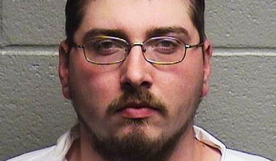 This undated mugshot provided by the Durham Police Department shows 24-year-old Brandon Ayscue, who police say is charged with assault with a deadly weapon after an argument over towing a vehicle early Friday Nov. 22, 2019, in Durham, N.C. Police say that Ayscue shot the driver during an argument after attempting to tow the vehicle. (Durham Police Department via AP)