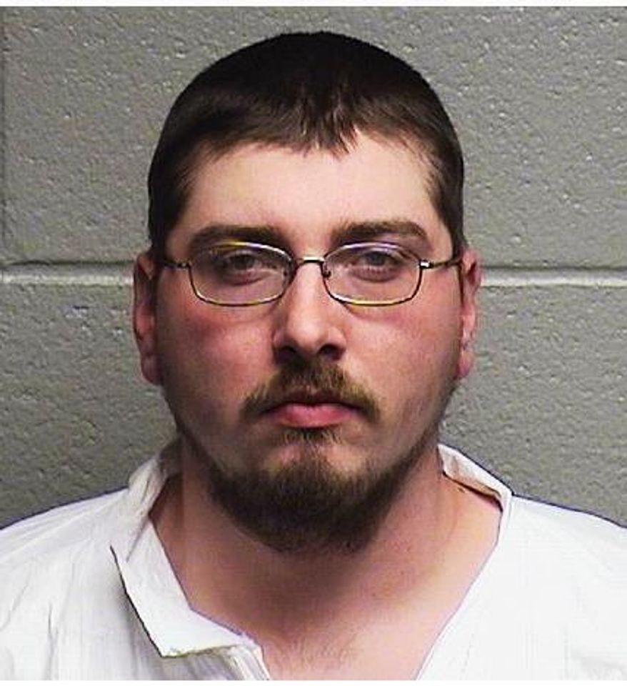 This undated mugshot provided by the Durham Police Department shows 24-year-old Brandon Ayscue, who police say is charged with assault with a deadly weapon after an argument over towing a vehicle early Friday Nov. 22, 2019, in Durham, N.C. Police say that Ayscue shot the driver during an argument after attempting to tow the vehicle. (Durham Police Department via AP)