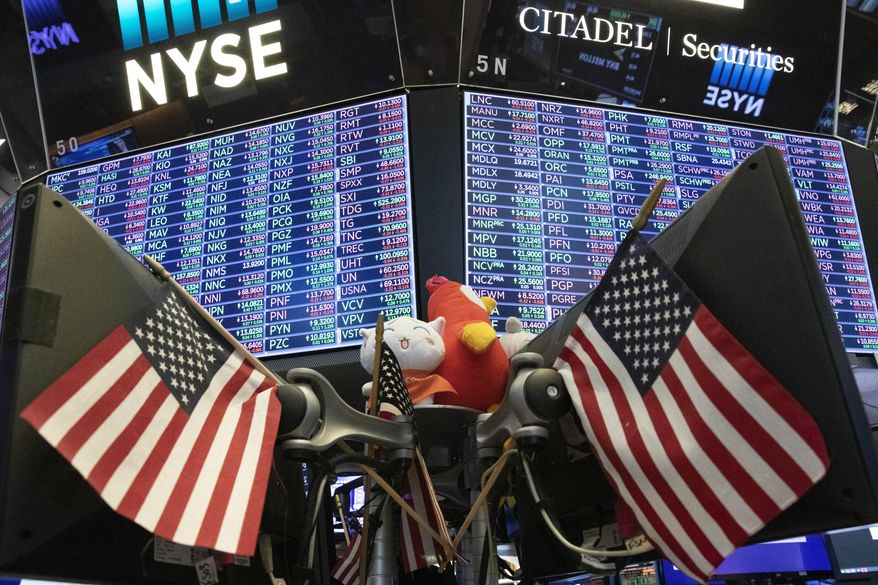 FILE - In this Sept. 18, 2019, file photo, stock prices are displayed at the New York Stock Exchange. U.S. stocks pushed upward in early trading Friday, Nov. 22, 2019, following a global tide higher, as a week clouded by uncertainty about progress in U.S.-China trade talks comes to a close. (AP Photo/Mark Lennihan, File)