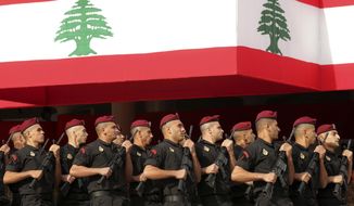 Lebanese marine special forces soldiers march during a military parade to mark the 76th anniversary of Lebanon&#39;s independence from France at the Lebanese Defense Ministry, in Yarzeh near Beirut, Lebanon, Friday, Nov. 22, 2019. Lebanon&#39;s top politicians attended Friday a military parade on the country&#39;s 76th Independence Day, appearing for the first time since the government resigned amid nationwide protests now in their second month. (AP Photo/Hassan Ammar)