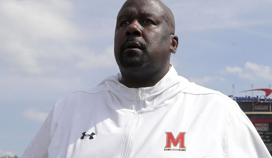 FILE - In this Aug. 31, 2019, file photo, Maryland head coach Michael Locksley walks with his team after an NCAA college football game against Howard, in College Park, Md. Nebraska (4-6, 2-5 Big Ten) travels to Maryland (3-7, 1-6) for a Saturday, Nov. 23 game. (AP Photo/Julio Cortez, File)