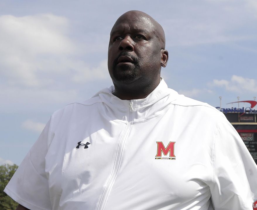 FILE - In this Aug. 31, 2019, file photo, Maryland head coach Michael Locksley walks with his team after an NCAA college football game against Howard, in College Park, Md. Nebraska (4-6, 2-5 Big Ten) travels to Maryland (3-7, 1-6) for a Saturday, Nov. 23 game. (AP Photo/Julio Cortez, File)