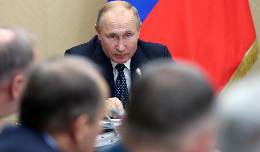 Russian President Vladimir Putin chairs a Security Council meeting at the Novo-Ogaryovo residence outside Moscow, Russia, Friday, Nov. 22, 2019. (Yekaterina Shtukina, Sputnik, Government Pool Photo via AP)