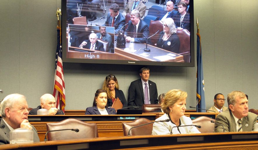Lawmakers on the Joint Legislative Committee on the Budget listen to officials with Gov. John Bel Edwards' administration discuss a cyberattack against state government computer servers, during a meeting Friday, Nov. 22, 2019, in Baton Rouge, La. (AP Photo/Melinda Deslatte)