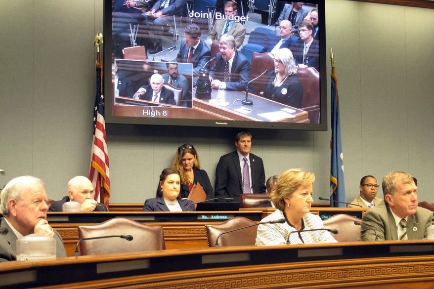 Lawmakers on the Joint Legislative Committee on the Budget listen to officials with Gov. John Bel Edwards' administration discuss a cyberattack against state government computer servers, during a meeting Friday, Nov. 22, 2019, in Baton Rouge, La. (AP Photo/Melinda Deslatte)