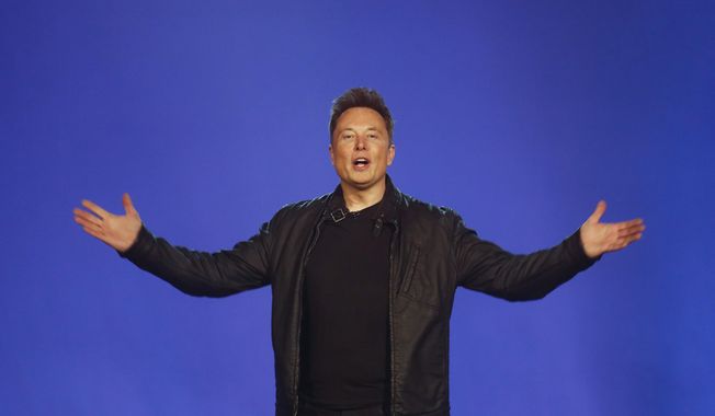 Tesla CEO Elon Musk introduces the Cybertruck at Tesla&#x27;s design studio Thursday, Nov. 21, 2019, in Hawthorne, Calif. Musk is taking on the workhorse heavy pickup truck market with his latest electric vehicle. (AP Photo/Ringo H.W. Chiu)