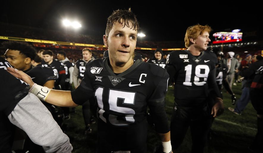 Iowa State quarterback Brock Purdy celebrates with teammates after an NCAA college football game against Texas, Saturday, Nov. 16, 2019, in Ames, Iowa. Iowa State won 23-21. (AP Photo/Charlie Neibergall)