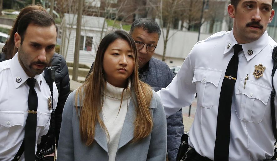 Inyoung You arrives at Suffolk Superior Court in Boston, Friday, Nov. 22, 2019. Prosecutors say You sent her boyfriend Alexander Urtula more than 47,000 text messages in the last two months of their relationship, including many urging him to "go kill yourself." (AP Photo/Michael Dwyer)