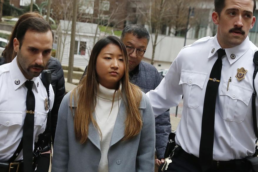 Inyoung You arrives at Suffolk Superior Court in Boston, Friday, Nov. 22, 2019. Prosecutors say You sent her boyfriend Alexander Urtula more than 47,000 text messages in the last two months of their relationship, including many urging him to "go kill yourself." (AP Photo/Michael Dwyer)