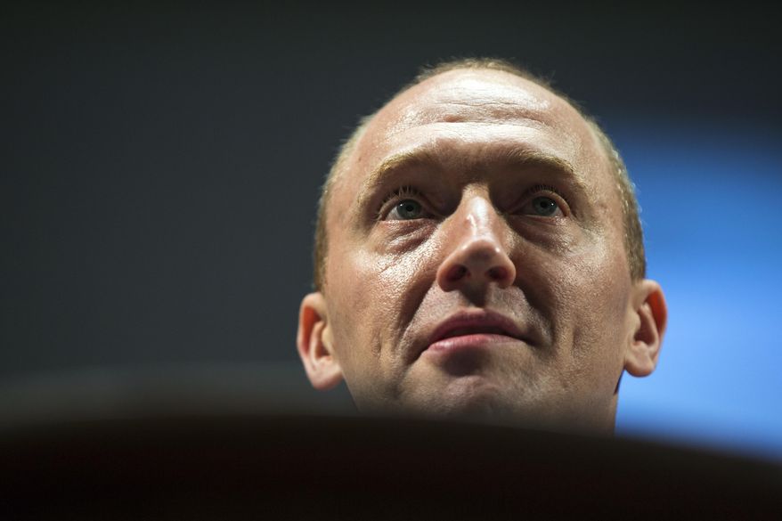 Carter Page, an adviser to U.S. Republican presidential candidate Donald Trump, speaks at the graduation ceremony for the New Economic School in Moscow on July 8, 2016. (AP Photo/Pavel Golovkin) **FILE**