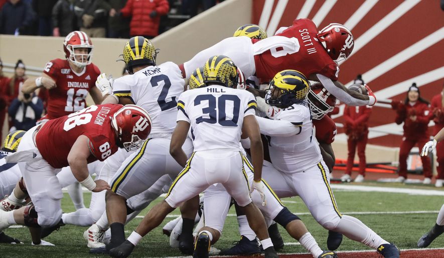 Indiana running back Stevie Scott III (8) goes in for a touchdown during the first half of an NCAA college football game against Michigan, Saturday, Nov. 23, 2019, in Bloomington, Ind. (AP Photo/Darron Cummings)