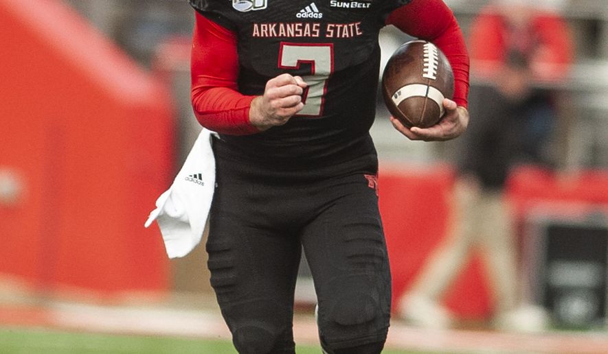 Arkansas State quarterback Layne Hatcher runs with the ball during the first half of an NCAA college football game against Georgia Southern, Saturday, Nov. 23, 2019, at Centennial Bank Stadium in Jonesboro, Ark. (Quentin Winstine/The Jonesboro Sun via AP)