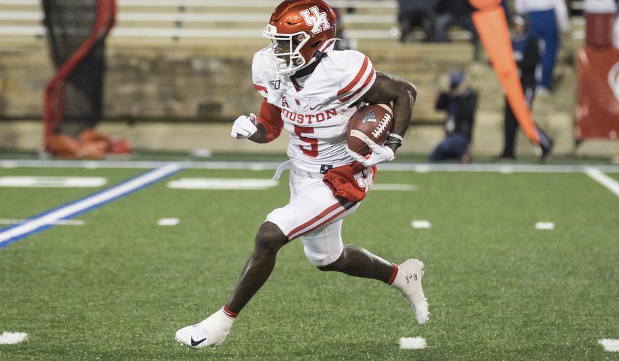 Houston wide receiver Marquez Stevenson returns a Tulsa kickoff during an NCAA college football game Saturday, Nov. 23, 2019, in Tulsa, Okla. (Brett Rojo/Tulsa World via AP)