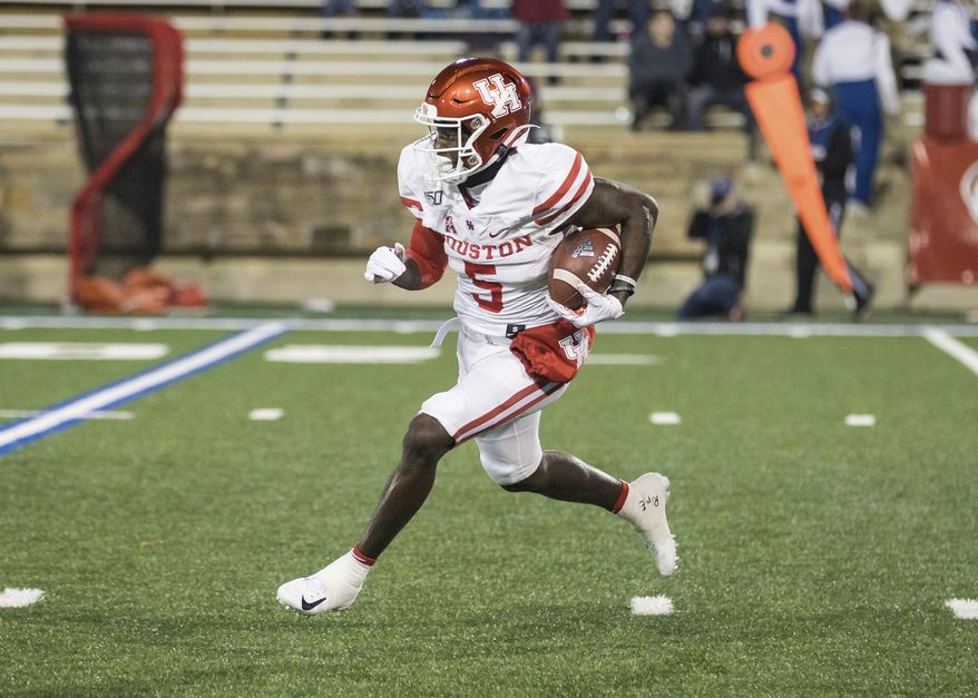Houston wide receiver Marquez Stevenson returns a Tulsa kickoff during an NCAA college football game Saturday, Nov. 23, 2019, in Tulsa, Okla. (Brett Rojo/Tulsa World via AP)