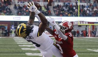 Michigan wide receiver Donovan Peoples-Jones (9) makes a touchdown reception against Indiana defensive back Tiawan Mullen (3) during the first half of an NCAA college football game, Saturday, Nov. 23, 2019, in Bloomington, Ind. (AP Photo/Darron Cummings)
