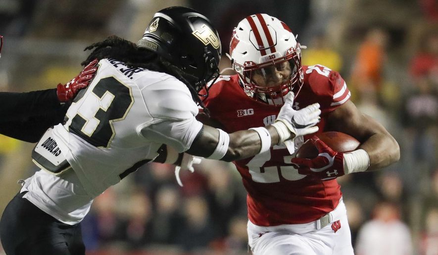 Wisconsin&#x27;s Jonathan Taylor runs during the second half of an NCAA college football game against Purdue Saturday, Nov. 23, 2019, in Madison, Wis. (AP Photo/Morry Gash)