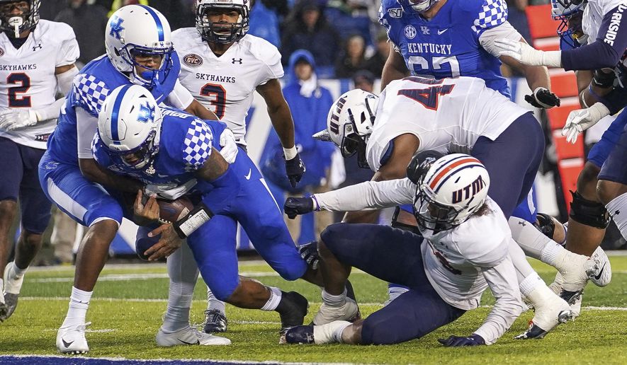 Kentucky quarterback Lynn Bowden Jr. (1) dives into the end zone for a touchdown during the first half of an NCAA college football game against UT Martin, Saturday, Nov. 23, 2019, in Lexington, Ky. (AP Photo/Bryan Woolston)
