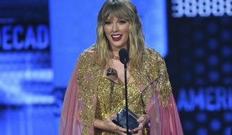 Taylor Swift accepts the award for artist of the decade at the American Music Awards on Sunday, Nov. 24, 2019, at the Microsoft Theater in Los Angeles. (Photo by Chris Pizzello/Invision/AP)