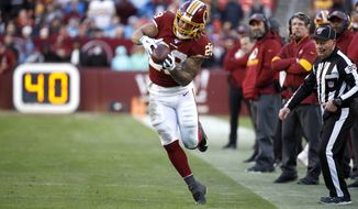Washington Redskins running back Derrius Guice makes a catch against the Detroit Lions during the second half of an NFL football game, Sunday, Nov. 24, 2019, in Landover, Md. The Redskins won 19-16. (AP Photo/Patrick Semansky)