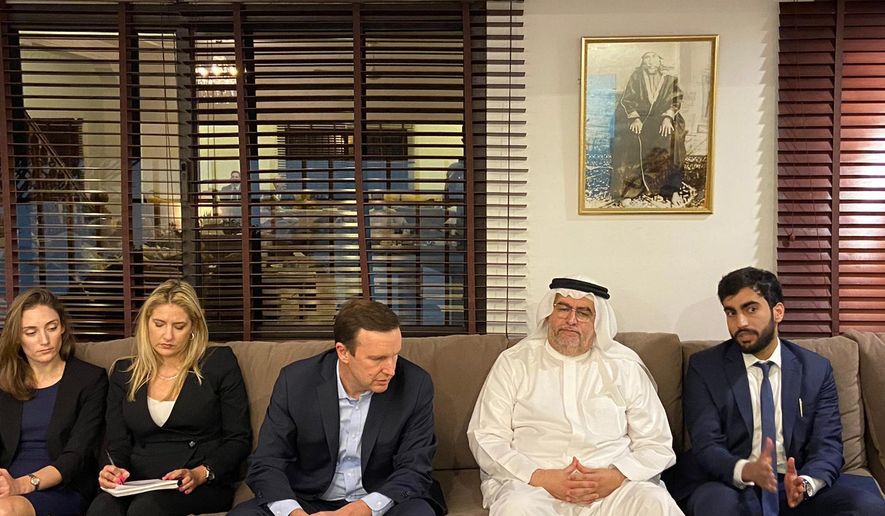 In this Saturday, Nov. 23, 2019 photo, provided by activists, U.S. Sen. Chris Murphy, D-Connecticut, center, listens to Adam Nabeel Rajab, right son of imprisoned Bahraini human rights activist Nabeel Rajab, at the family&#x27;s home in Manama, Bahrain. Murphy had been in the kingdom for the annual Manama Dialogue security conference. (AP Photo)