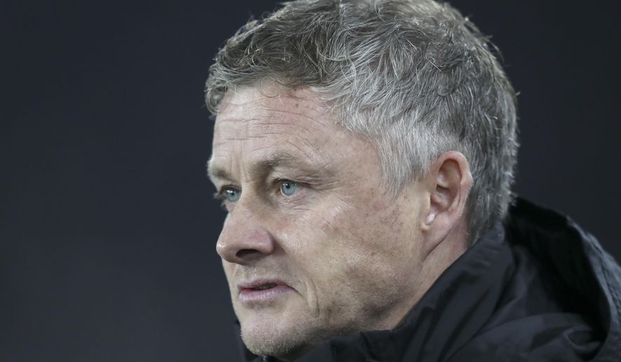Manchester United's manager Ole Gunnar Solskjaer looks on before the English Premier League soccer match between Sheffield United and Manchester United at Bramall Lane Stadium in Sheffield, England, Sunday, Nov. 24, 2019. (AP Photo/Jon Super)