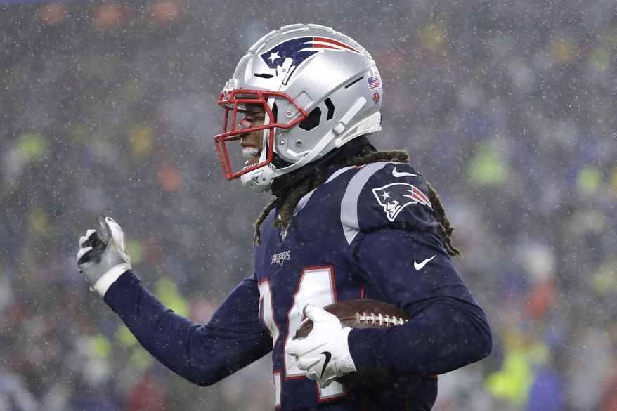 New England Patriots cornerback Stephon Gilmore celebrates his interception against the Dallas Cowboys in the first half of an NFL football game, Sunday, Nov. 24, 2019, in Foxborough, Mass. (AP Photo/Steven Senne)