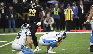 Carolina Panthers kicker Joey Slye (4) reacts after missing a field goal, late in the fourth quarter during an NFL football game against the New Orleans Saints, Sunday, Nov. 24, 2019, in New Orleans. Carolina Panthers punter Michael Palardy (5) holds while New Orleans Saints defensive back Johnson Bademosi (29) reacts. (AP Photo/Bill Feig)