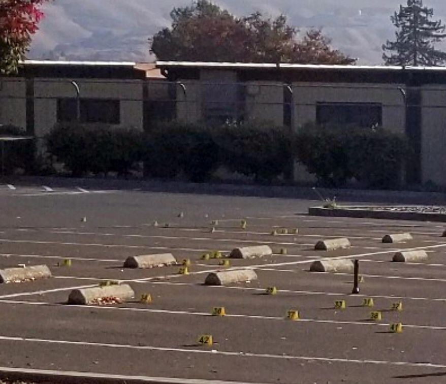 This Saturday, Nov. 23, 2019, photo released by the Union City Police Department shows crime scene evidence markers at the parking lot of the Searles Elementary School in Union City, Calif. Police say a deadly shootings of teenage boys took place early Saturday morning in the parking lot. Authorities say that when officers arrived, they found the boys. (Union City Police Department via AP)