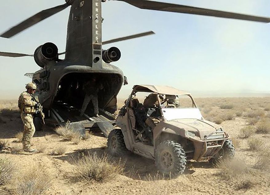 ALL TERRAIN VEHICLE
Soldiers with Special Operations Task Force - South prepare to load an all-terrain vehicle on to a CH-47 Chinook helicopter in preparation for a rapid offload during operations Oct. 1 in the Maruf District, Kandahar Province, Afghanistan. Photo by Spc. Jesse LaMorte, Special Operations Task Force - South