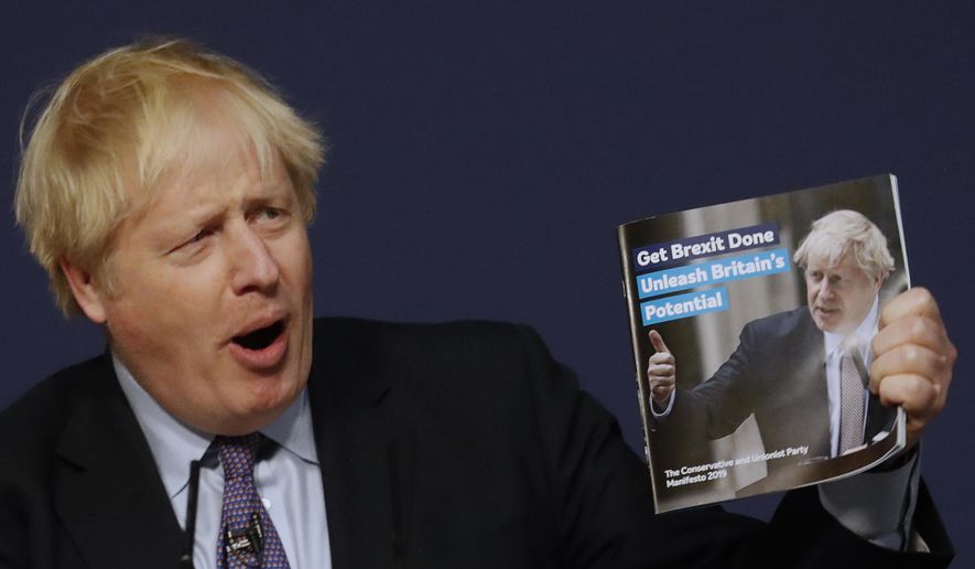 Britain's Prime Minister Boris Johnson presents the Conservative Party's Manifesto for the General Election campaign, in Telford, England, Sunday, Nov. 24, 2019. Britain goes to the polls on Dec. 12. (AP Photo/Frank Augstein)