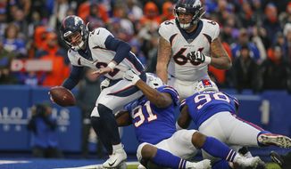 Buffalo Bills defensive tackle Ed Oliver (91) pulls down Denver Broncos quarterback Brandon Allen (2) into the end zone for a sack during the fourth quarter of an NFL football game, Sunday, Nov. 24, 2019, in Orchard Park, N.Y. (AP Photo/John Munson)