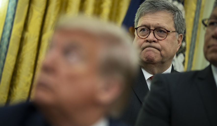 Attorney General William Barr listens as President Donald Trump speaks during an event to sign an executive order establishing the Task Force on Missing and Murdered American Indians and Alaska Natives, in the Oval Office of the White House, Tuesday, Nov. 26, 2019, in Washington. (AP Photo/ Evan Vucci)