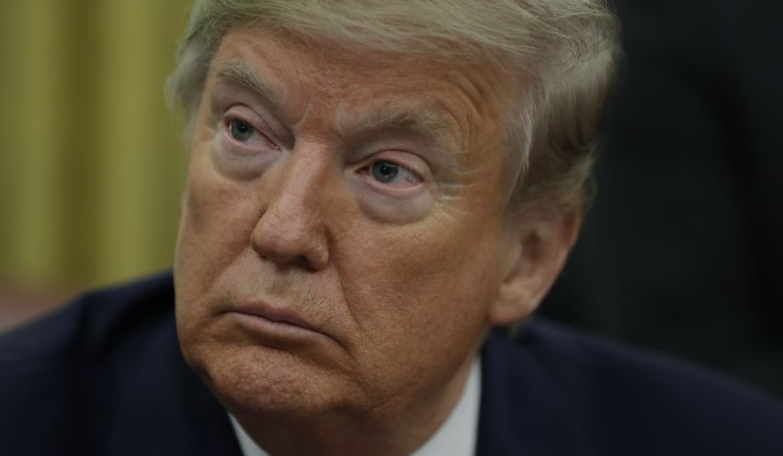 President Donald Trump signs an executive order establishing the Task Force on Missing and Murdered American Indians and Alaska Natives, in the Oval Office of the White House, Tuesday, Nov. 26, 2019, in Washington. (AP Photo/ Evan Vucci)