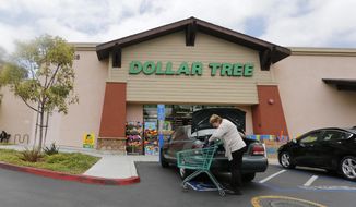 FILE - In this May 26, 2016, file photo, a shopper searches her purse outside a Dollar Tree store in Encinitas, Calif. Dollar Tree Inc. on Tuesday, Nov. 26, 2019, reported fiscal third-quarter profit of $255.8 million. (AP Photo/Lenny Ignelzi, File)