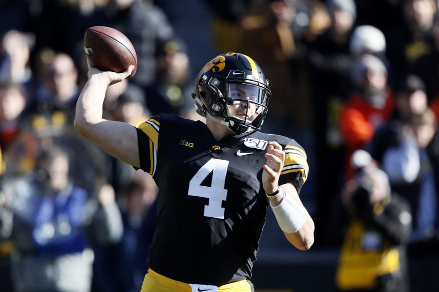 Iowa quarterback Nate Stanley throws a pass during the first half of an NCAA college football game against Illinois, Saturday, Nov. 23, 2019, in Iowa City, Iowa. Iowa won 19-10. (AP Photo/Charlie Neibergall)
