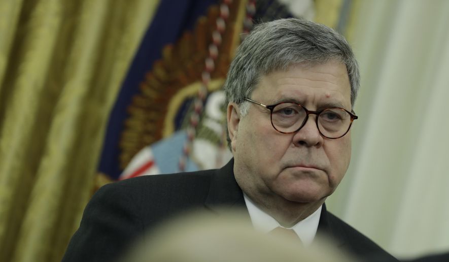 Attorney General William Barr listens as President Donald Trump speaks during an event to sign an executive order establishing the Task Force on Missing and Murdered American Indians and Alaska Natives, in the Oval Office of the White House, Tuesday, Nov. 26, 2019, in Washington. (AP Photo/ Evan Vucci) ** FILE **
