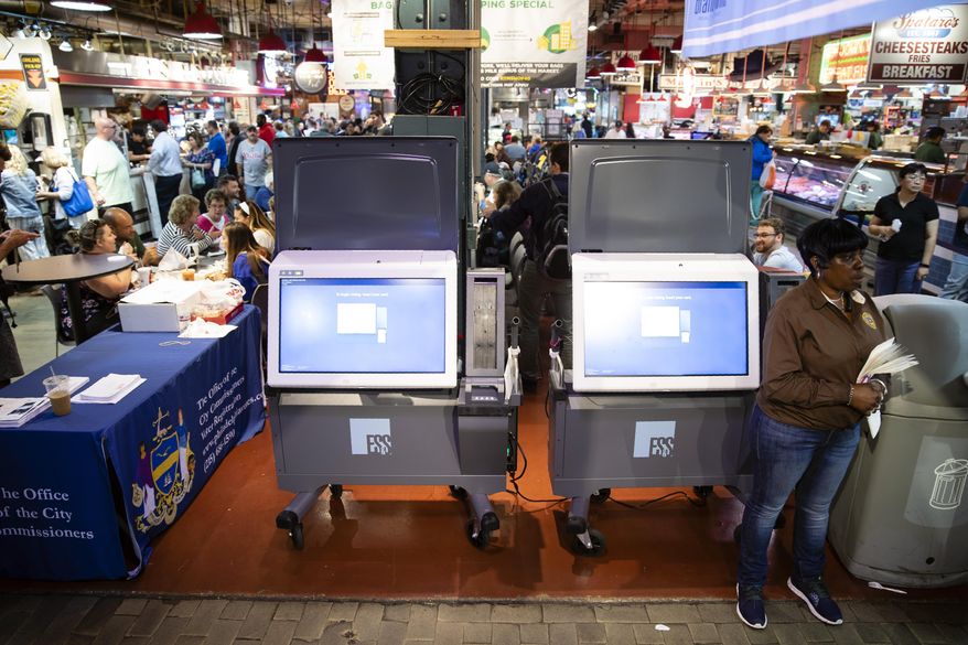 In this June 13, 2019, file photo, ExpressVote XL voting machines are displayed during a demonstration at the Reading Terminal Market in Philadelphia. Former Green Party presidential candidate Jill Stein and several supporters filed court papers Tuesday, Nov. 26, 2019, accusing Pennsylvania of violating their year-old agreement in Philadelphia's federal court by certifying the ExpressVote XL touchscreen system made by Omaha, Nebraska-based Election Systems & Software. (AP Photo/Matt Rourke, File) **FILE**