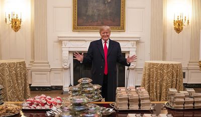 President Donald J. Trump welcomes members of the press to the State Dining Room Monday, January 14, 2019, where the 2018 NCAA Football National Champions, the Clemson Tigers, will be welcomed with food from Domino’s, McDonald’s, Wendy’s and Burger King. (Official White House Photo by Joyce N. Boghosian)