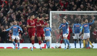 Liverpool&#39;s Dejan Lovren, second left, celebrates scoring his side&#39;s first goal during the Champions League Group E soccer match between Liverpool and Napoli at Anfield stadium in Liverpool, England, Wednesday, Nov. 27, 2019. (AP Photo/Jon Super)