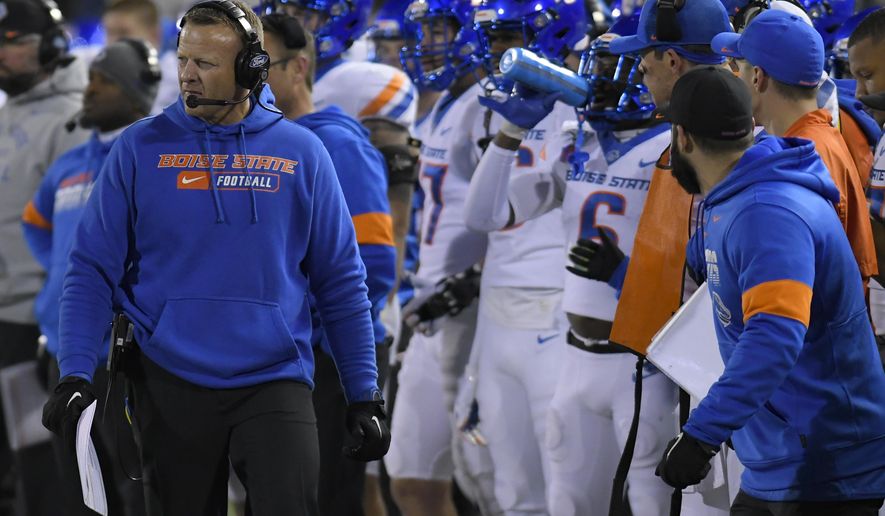 Boise State coach Bryan Harsin watches the team play Utah State during the first half of an NCAA college football game Saturday, Nov. 23, 2019, in Logan, Utah. (AP Photo/Eli Lucero)