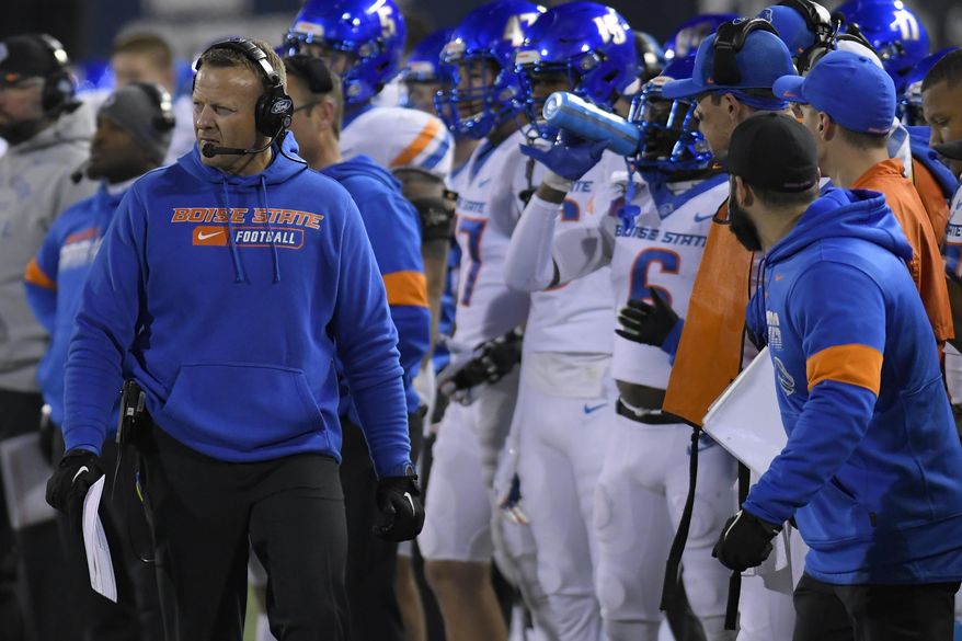 Boise State coach Bryan Harsin watches the team play Utah State during the first half of an NCAA college football game Saturday, Nov. 23, 2019, in Logan, Utah. (AP Photo/Eli Lucero)