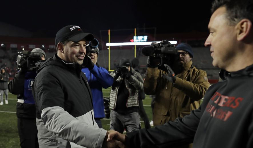 Ohio State head coach Ryan Day shakes hands with Rutgers interim head coach Nunzio Campanile after their NCAA college football game Saturday, Nov. 16, 2019, in Piscataway, N.J. Ohio State won 56-21. (AP Photo/Adam Hunger)